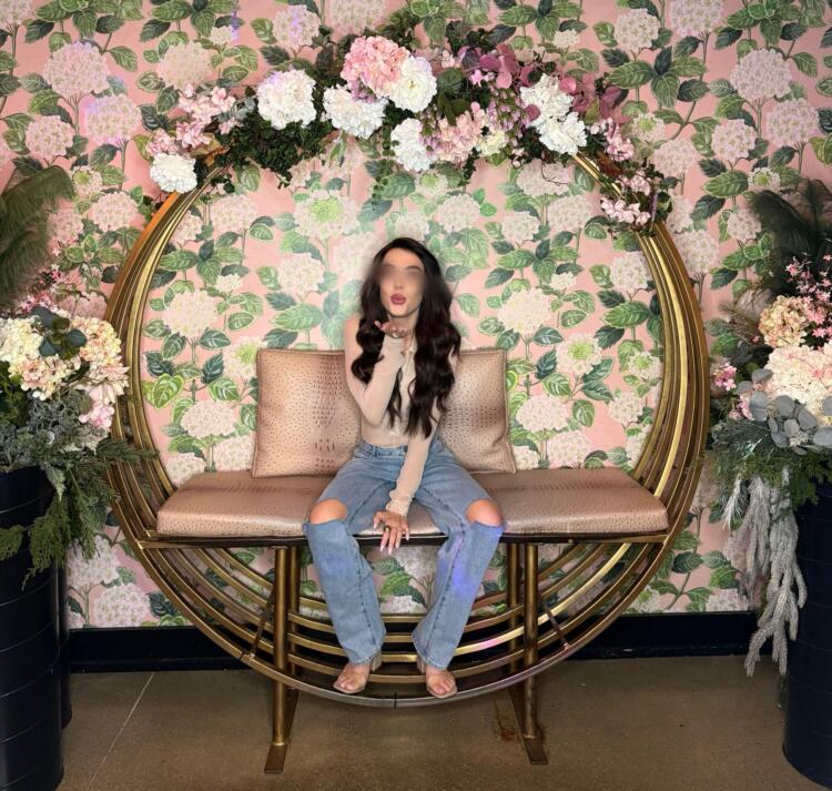 woman blowing kisses in the garden